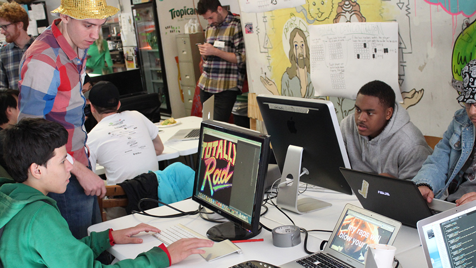 Poetic science fair, people using computers